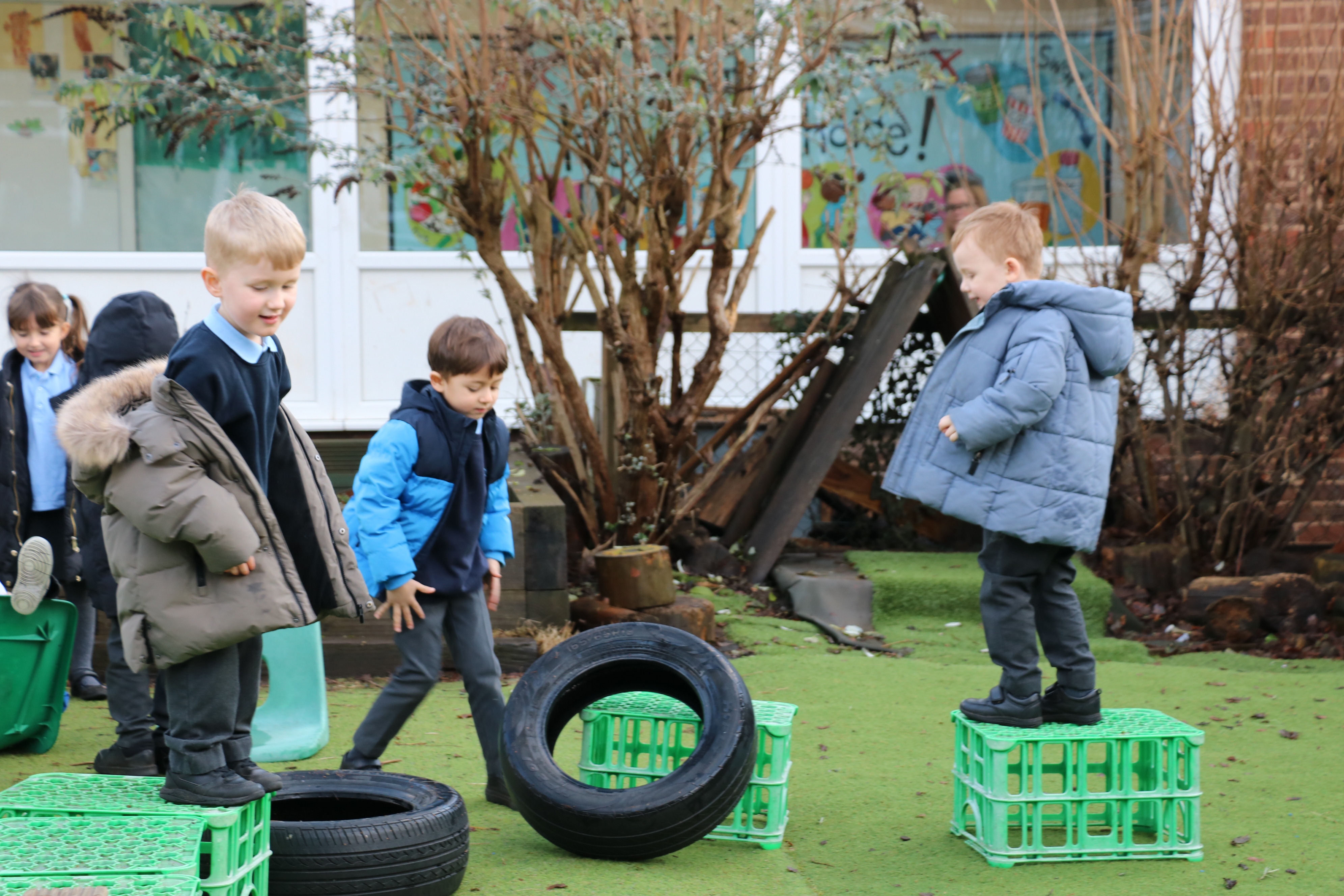 Children running across the school field