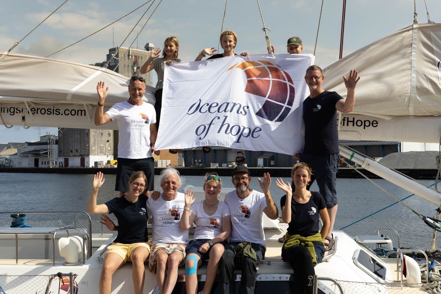 The Oceans of Hope crew with their flag