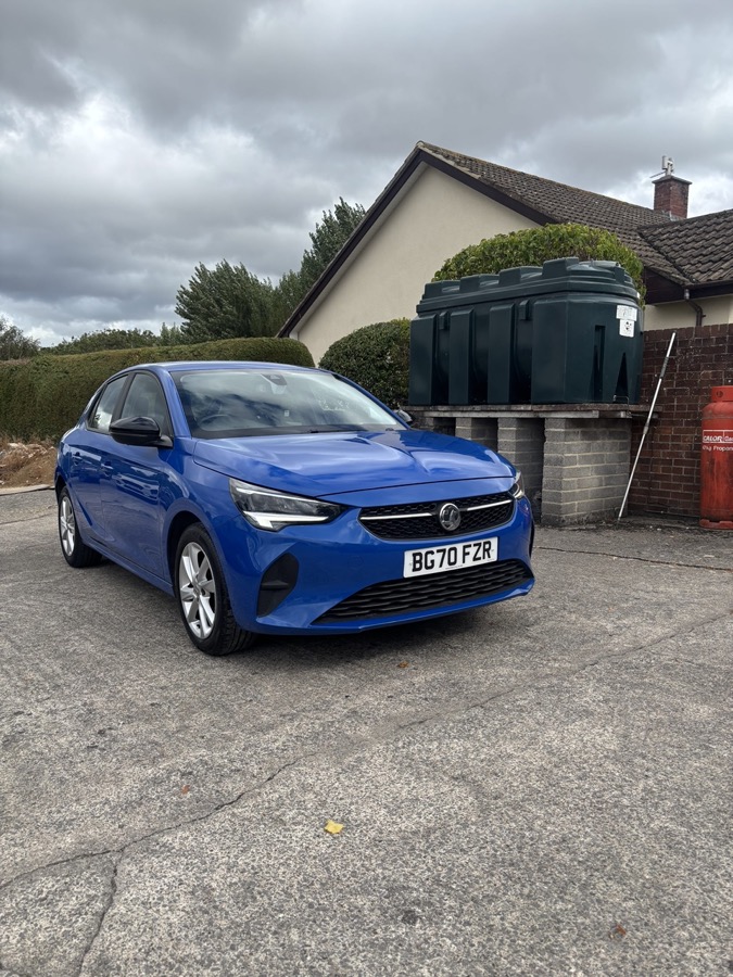 A blue 70-plate Vauxhall Corsa on the forecourt at Stogursey, registration BG70 FZR