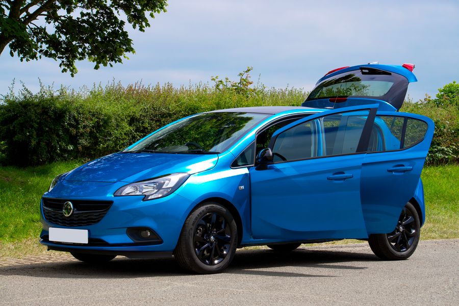 A blue Vauxhall Corsa with its doors open