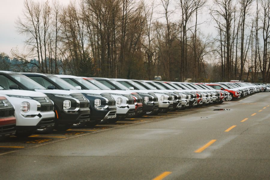 A row of used cars on a forecourt