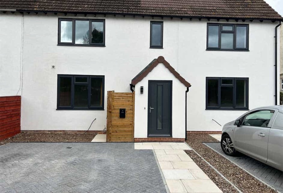 The finished white house at Cold Pool Lane with its new drive