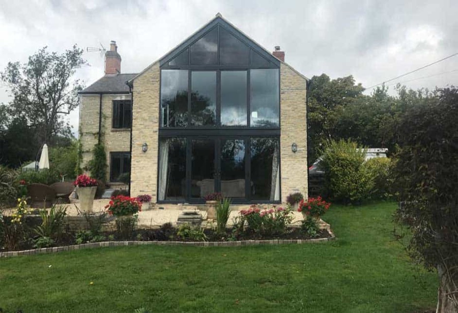 The front of a house with 8 plate glass windows