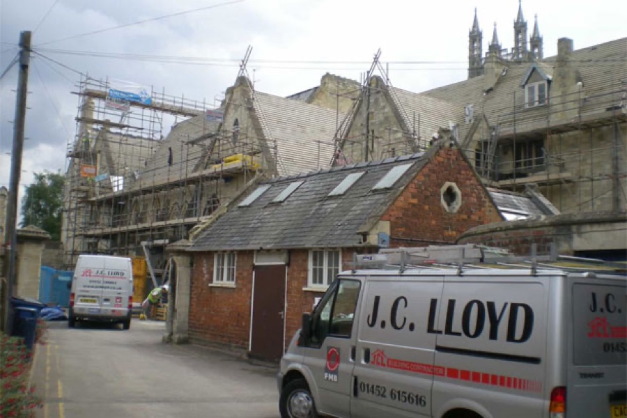 A J C Lloyd roofer at work on a roof