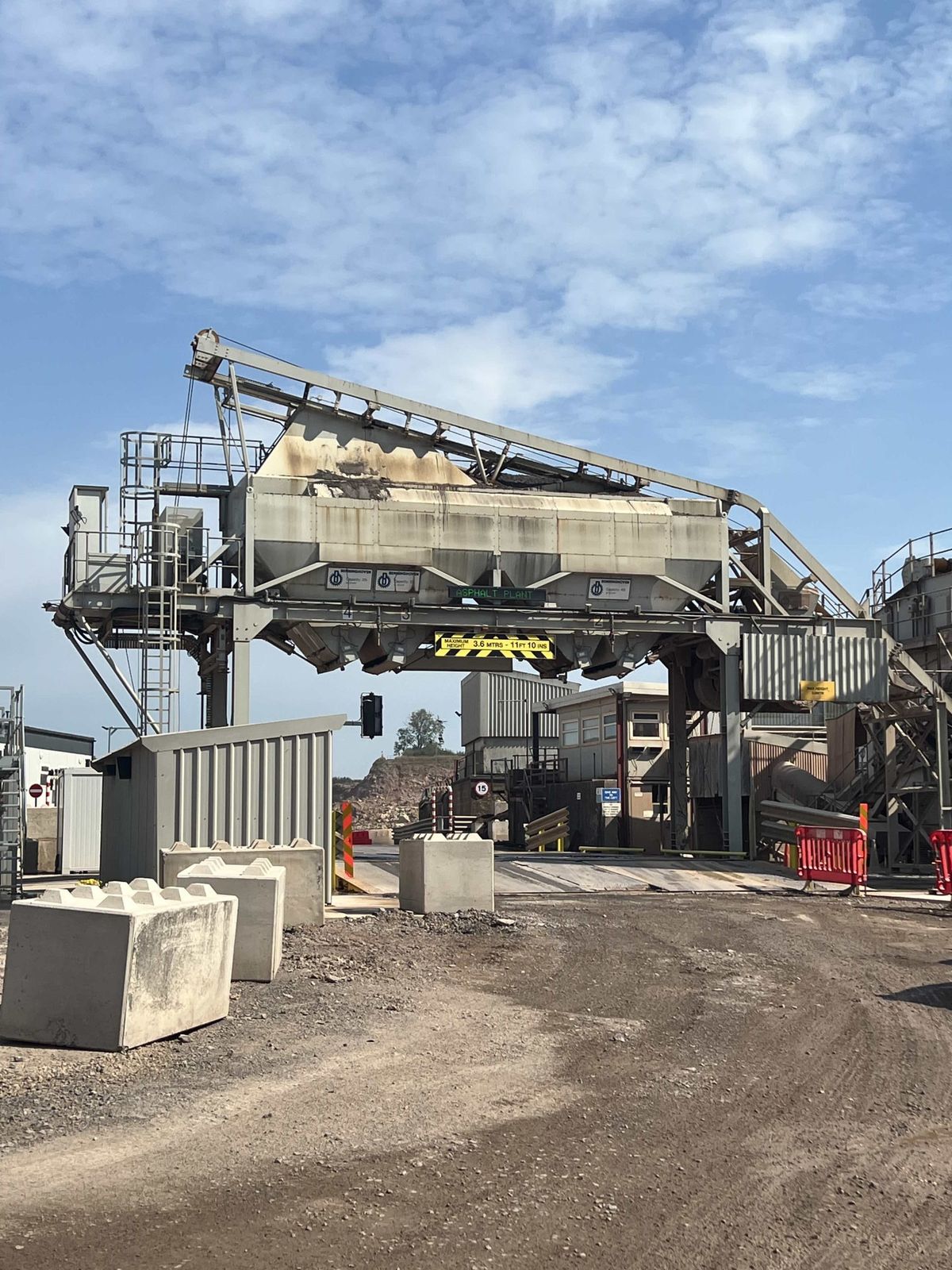 The asphalt plant's mixing tower and conveyors at Gurney Slade