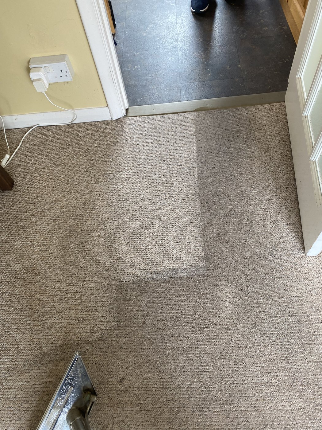 Traffic lane lifted out of a lounge carpet — before