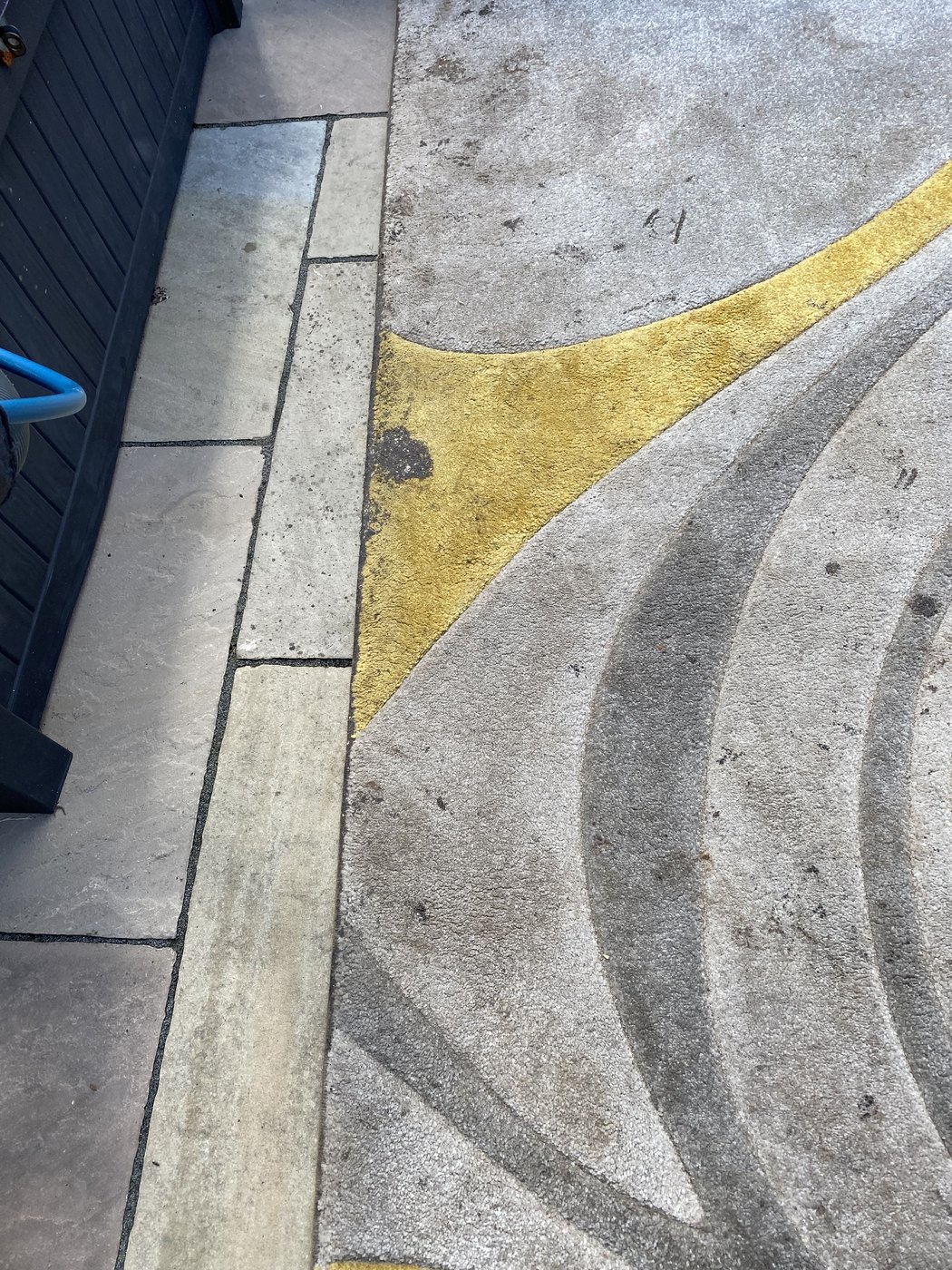 Patterned rug, colour brought back — before