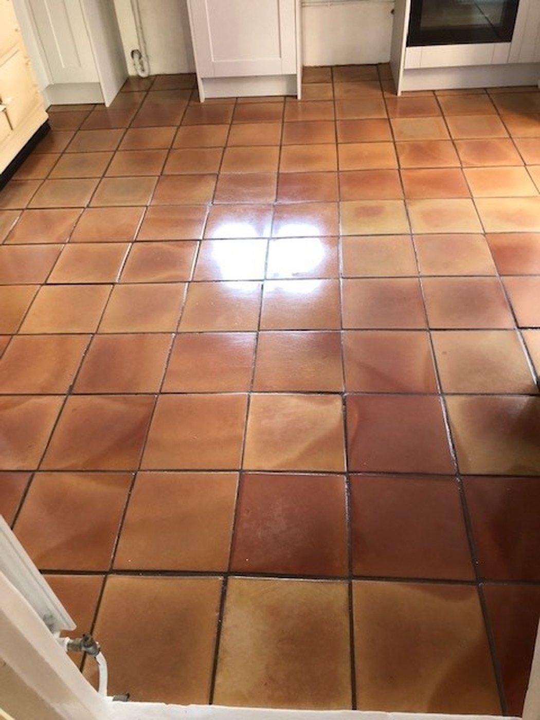 A terracotta floor restored by Ashton Cleaning — after