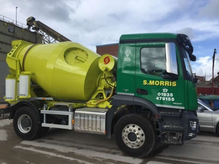 An S. Morris mini mix truck, a compact two-axle mixer with a yellow drum